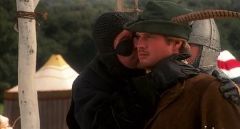 Movie still from “Robin Hood: Men in Tights” (1993), directed by Mel Brooks – Two men in medieval garb embracing each other; Close Up shot, Over the shoulder angle