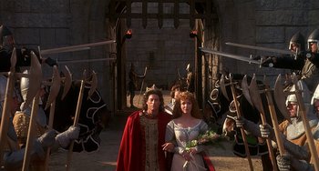 Movie still from “Robin Hood: Men in Tights” (1993), directed by Mel Brooks – A couple of people dressed up in medieval costumes; Wide shot, High angle