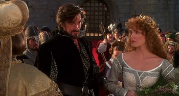 Movie still from “Robin Hood: Men in Tights” (1993), directed by Mel Brooks – A man and a woman standing next to each other; Medium shot, Over the shoulder angle