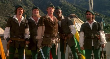 Movie still from “Robin Hood: Men in Tights” (1993), directed by Mel Brooks – A group of men dressed in medieval garb; Medium shot, Low angle