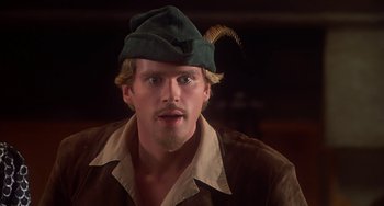 Movie still from “Robin Hood: Men in Tights” (1993), directed by Mel Brooks – A person wearing a hat; Close Up shot, Low angle