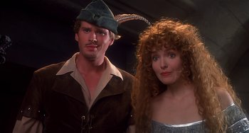 Movie still from “Robin Hood: Men in Tights” (1993), directed by Mel Brooks – A man and a woman dressed up in costumes; Close Up shot, Low angle