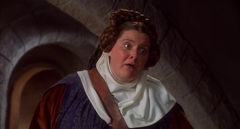Movie still from “Robin Hood: Men in Tights” (1993), directed by Mel Brooks – A woman with a surprised look on her face; Close Up shot, High angle