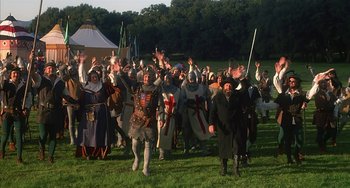 Movie still from “Robin Hood: Men in Tights” (1993), directed by Mel Brooks – A group of people dressed in medieval costumes; Wide shot, High angle