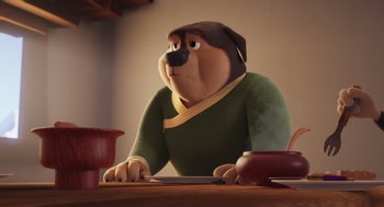 Movie still from “Rock Dog 2: Rock Around the Park” (2021), directed by Mark Baldo – A cartoon dog sitting at a table looking up; Medium shot, High angle