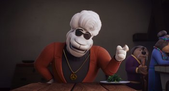 Movie still from “Rock Dog 2: Rock Around the Park” (2021), directed by Mark Baldo – An animated character sitting at a table with a plate of food; Medium shot, Over the shoulder angle