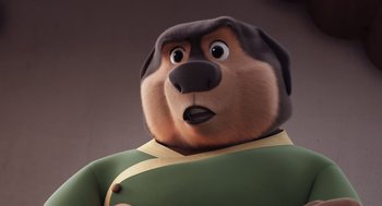Movie still from “Rock Dog 2: Rock Around the Park” (2021), directed by Mark Baldo – A cartoon dog wearing a green uniform and looking up at the sky; Close Up shot, High angle