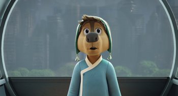 Movie still from “Rock Dog 2: Rock Around the Park” (2021), directed by Mark Baldo – A cartoon dog wearing a blue shirt and a green hat; Close Up shot, Over the shoulder angle
