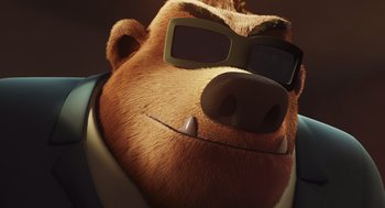 Movie still from “Rock Dog 2: Rock Around the Park” (2021), directed by Mark Baldo – A brown bear wearing sunglasses and a suit; Close Up shot, Low angle