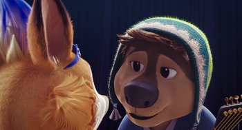 Movie still from “Rock Dog 2: Rock Around the Park” (2021), directed by Mark Baldo – A stuffed bear and a stuffed bird; Close Up shot, Over the shoulder angle