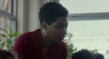 Movie still from “Rocks” (2019), directed by Sarah Gavron – A person wearing a red shirt; Close Up shot, Over the shoulder angle