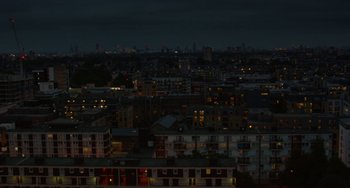 Movie still from “Rocks” (2019), directed by Sarah Gavron – A view of a city at night from above; Extreme Wide shot, High angle