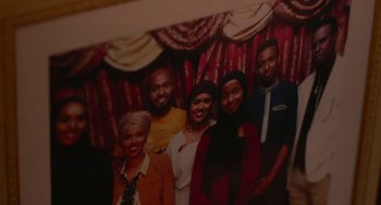 Movie still from “Rocks” (2019), directed by Sarah Gavron – A group of people standing next to each other in a room; Extreme Close Up shot, High angle