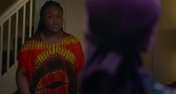 Movie still from “Rocks” (2019), directed by Sarah Gavron – A person standing in front of a mirror; Medium shot, Over the shoulder angle