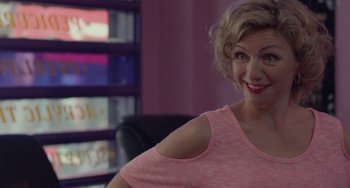 Movie still from “Rocks” (2019), directed by Sarah Gavron – A person sitting in a room; Close Up shot, Over the shoulder angle