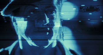 Movie still from “Rocky Balboa” (2006), directed by Sylvester Stallone – A man with his mouth taped shut is reflected in a mirror; Extreme Close Up shot, Over the shoulder angle