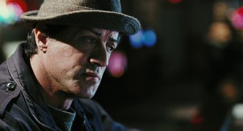 Movie still from “Rocky Balboa” (2006), directed by Sylvester Stallone – A person wearing a hat; Close Up shot, Over the shoulder angle
