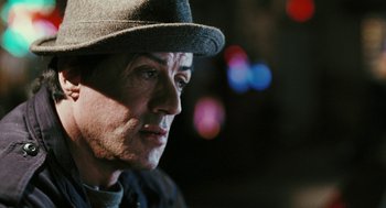 Movie still from “Rocky Balboa” (2006), directed by Sylvester Stallone – A person wearing a hat; Close Up shot, Over the shoulder angle