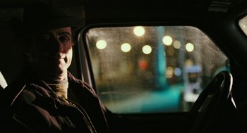 Movie still from “Rocky Balboa” (2006), directed by Sylvester Stallone – A man sitting in the back seat of a car looking out the window; Close Up shot, Over the shoulder angle