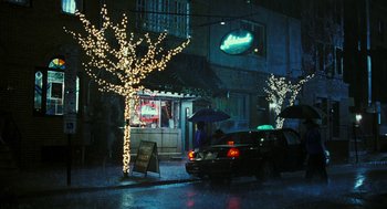 Movie still from “Rocky Balboa” (2006), directed by Sylvester Stallone – A car parked on the side of the street at night; Extreme Wide shot, Over the shoulder angle