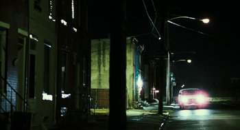 Movie still from “Rocky Balboa” (2006), directed by Sylvester Stallone – A car driving down a street at night; Extreme Wide shot, High angle