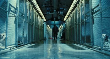 Movie still from “Rocky Balboa” (2006), directed by Sylvester Stallone – A person walking down a hallway in a building; Wide shot, Low angle
