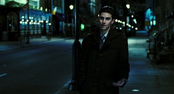 Movie still from “Rocky Balboa” (2006), directed by Sylvester Stallone – A man in a coat standing on the side of the street; Medium shot, Over the shoulder angle