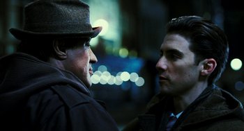 Movie still from “Rocky Balboa” (2006), directed by Sylvester Stallone – A man and a man standing next to each other; Close Up shot, Over the shoulder angle