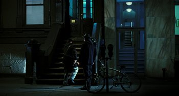 Movie still from “Rocky Balboa” (2006), directed by Sylvester Stallone – Two men standing on the steps of a building at night; Wide shot, High angle
