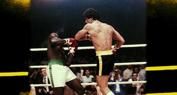 Movie still from “Rocky Balboa” (2006), directed by Sylvester Stallone – Two boxers in a boxing ring during a match; Medium shot, Low angle