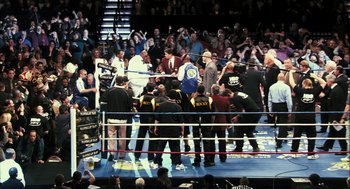 Movie still from “Rocky Balboa” (2006), directed by Sylvester Stallone – A group of people standing in a boxing ring; Extreme Wide shot, High angle