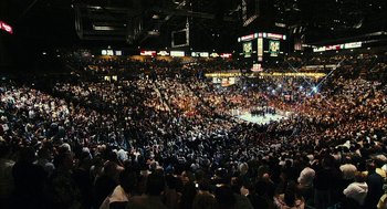 Movie still from “Rocky Balboa” (2006), directed by Sylvester Stallone – A crowd of people in an indoor arena; Extreme Wide shot, High angle