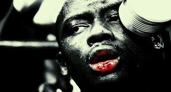 Movie still from “Rocky Balboa” (2006), directed by Sylvester Stallone – A person's face with black and white makeup on; Extreme Close Up shot, Low angle