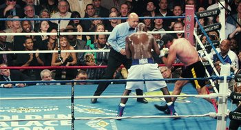 Movie still from “Rocky Balboa” (2006), directed by Sylvester Stallone – Two men in a boxing ring during a match; Wide shot, High angle