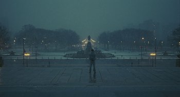 Movie still from “Rocky Balboa” (2006), directed by Sylvester Stallone – A person standing in front of a fountain on a snowy day; Extreme Wide shot, High angle