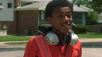 Movie still from “Roll Bounce” (2005), directed by Malcolm D. Lee – A young man with headphones around his neck; Close Up shot, Low angle