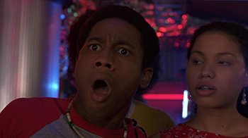 Movie still from “Roll Bounce” (2005), directed by Malcolm D. Lee – A young man with a surprised look on his face; Close Up shot, Low angle