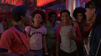 Movie still from “Roll Bounce” (2005), directed by Malcolm D. Lee – A group of young men standing next to each other; Medium shot, Low angle