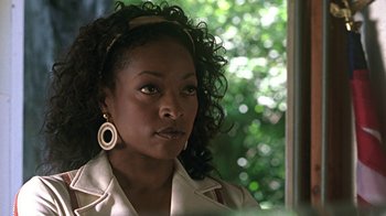 Movie still from “Roll Bounce” (2005), directed by Malcolm D. Lee – A person wearing a white shirt; Close Up shot, Over the shoulder angle