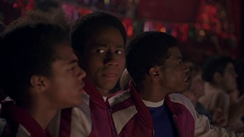 Movie still from “Roll Bounce” (2005), directed by Malcolm D. Lee – A group of young men standing next to each other; Close Up shot, Over the shoulder angle