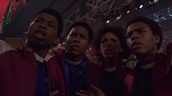 Movie still from “Roll Bounce” (2005), directed by Malcolm D. Lee – A group of young men standing next to each other; Close Up shot, Low angle