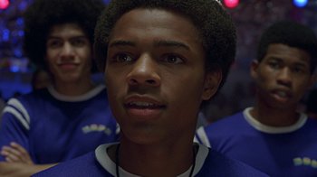 Movie still from “Roll Bounce” (2005), directed by Malcolm D. Lee – A person with a microphone; Close Up shot, Low angle