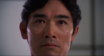 Movie still from “Rollerball” (1975), directed by Norman Jewison – A man's face in a room; Extreme Close Up shot, Low angle