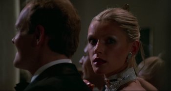 Movie still from “Rollerball” (1975), directed by Norman Jewison – A man and a woman in formal attire; Close Up shot, Low angle