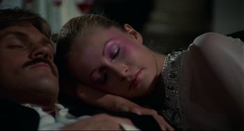 Movie still from “Rollerball” (1975), directed by Norman Jewison – A beautiful young lady laying on top of a bed; Close Up shot, High angle