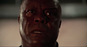 Movie still from “Rollerball” (1975), directed by Norman Jewison – A man's face as he stares into the distance; Close Up shot, Low angle