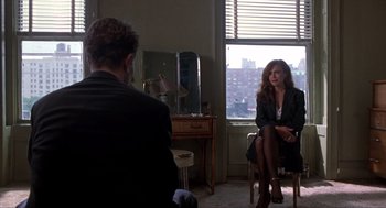 Movie still from “Romeo Is Bleeding” (1993), directed by Peter Medak – A man and a woman sitting in front of a window; Wide shot, Over the shoulder angle