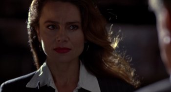 Movie still from “Romeo Is Bleeding” (1993), directed by Peter Medak – A person with long hair; Close Up shot, Low angle