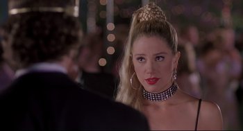 Movie still from “Romy and Michele's High School Reunion” (1997), directed by David Mirkin – A person wearing a necklace; Close Up shot, Over the shoulder angle