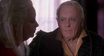 Movie still from “Romy and Michele's High School Reunion” (1997), directed by David Mirkin – An old man and a woman looking at each other; Close Up shot, Over the shoulder angle